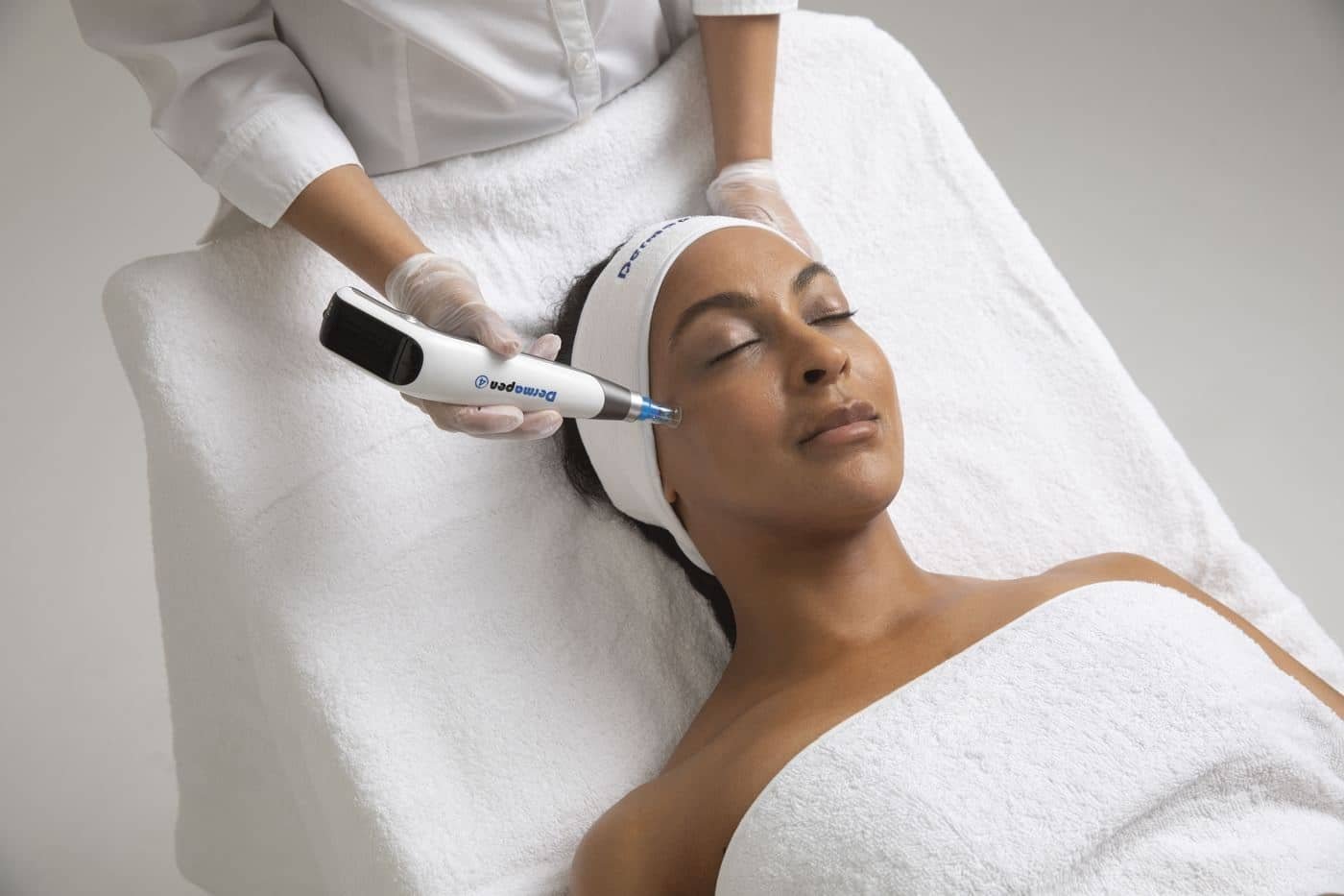 Dermapen4 microneedling treatment being performed on a client
